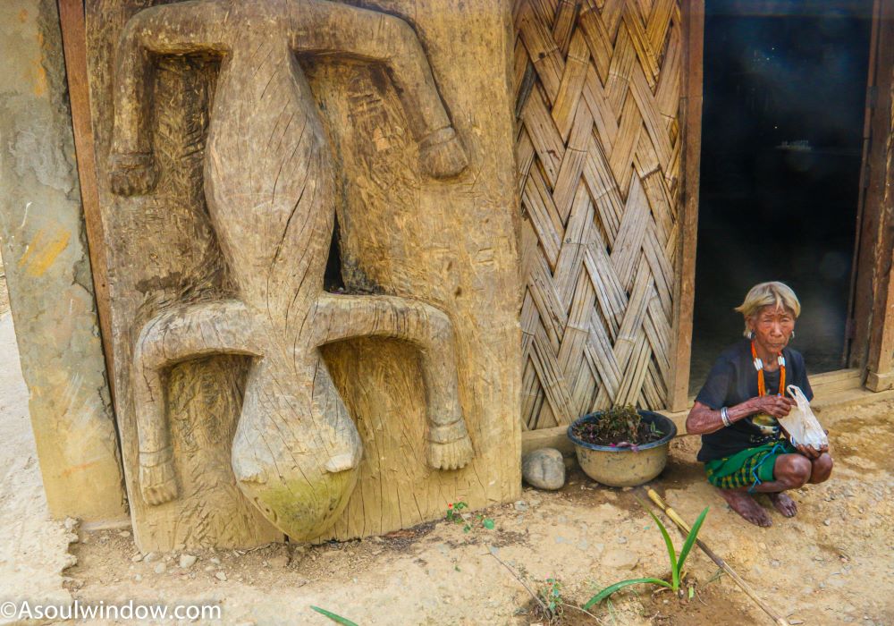 The Wancho Grandma at the main gate of home of her son, the King of Nyinu, Arunachal Pradesh