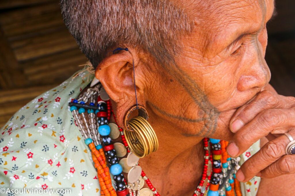 Stretched ear lobes, tattooed and shaved Ollo Nocte Woman in Lazu village, near India Myanmar border. Arunachal Pradesh
