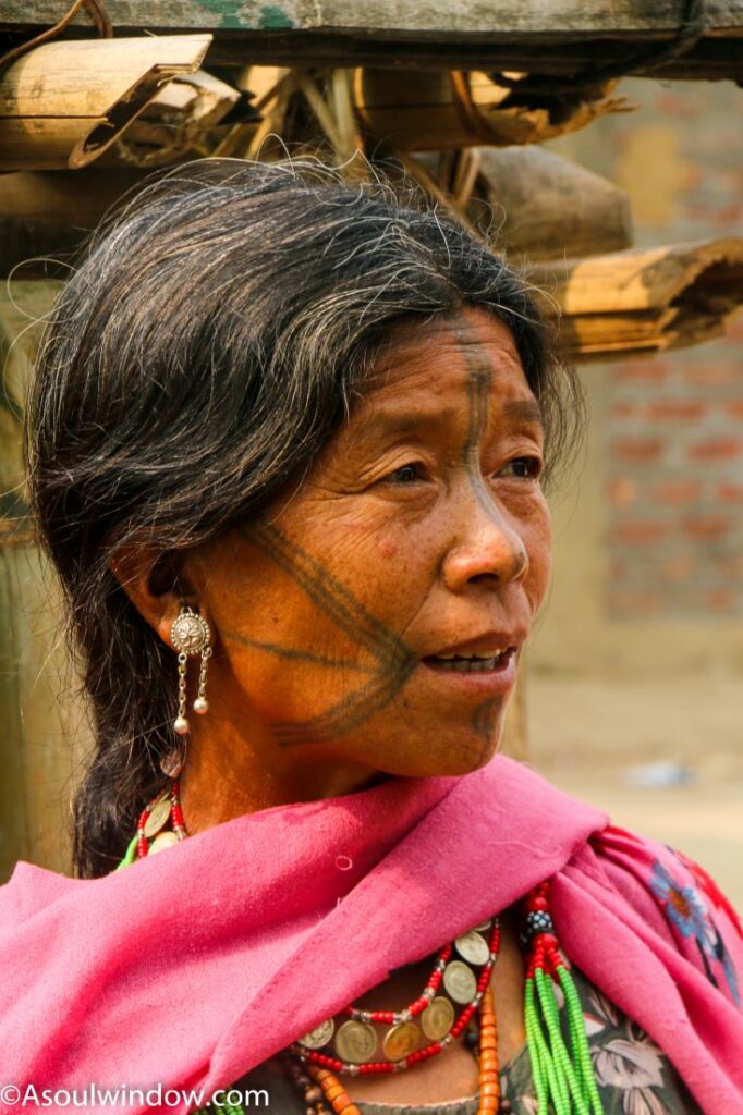 The tattooed Ollo Nocte Tribe woman in Lazu. Khonsa. North East India